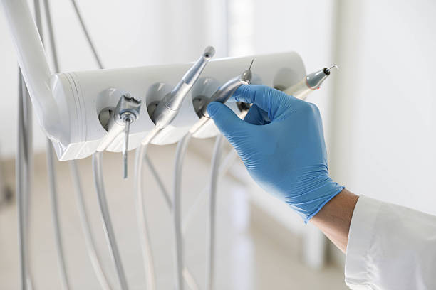 Professional Tooth Extraction technician working in Warrensburg, IL